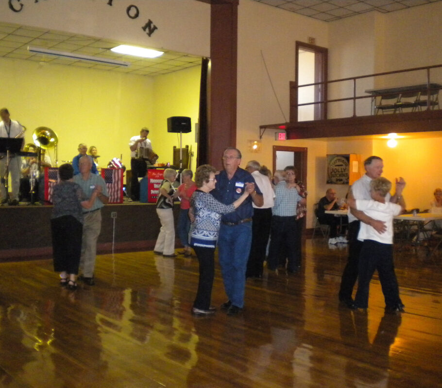 Inside Cashton Community Hall. People dancing while music plays.