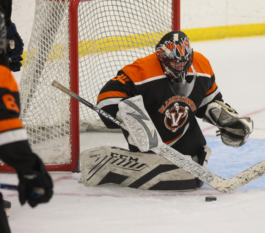 Boys Hockey. Picture showing goalie making save.