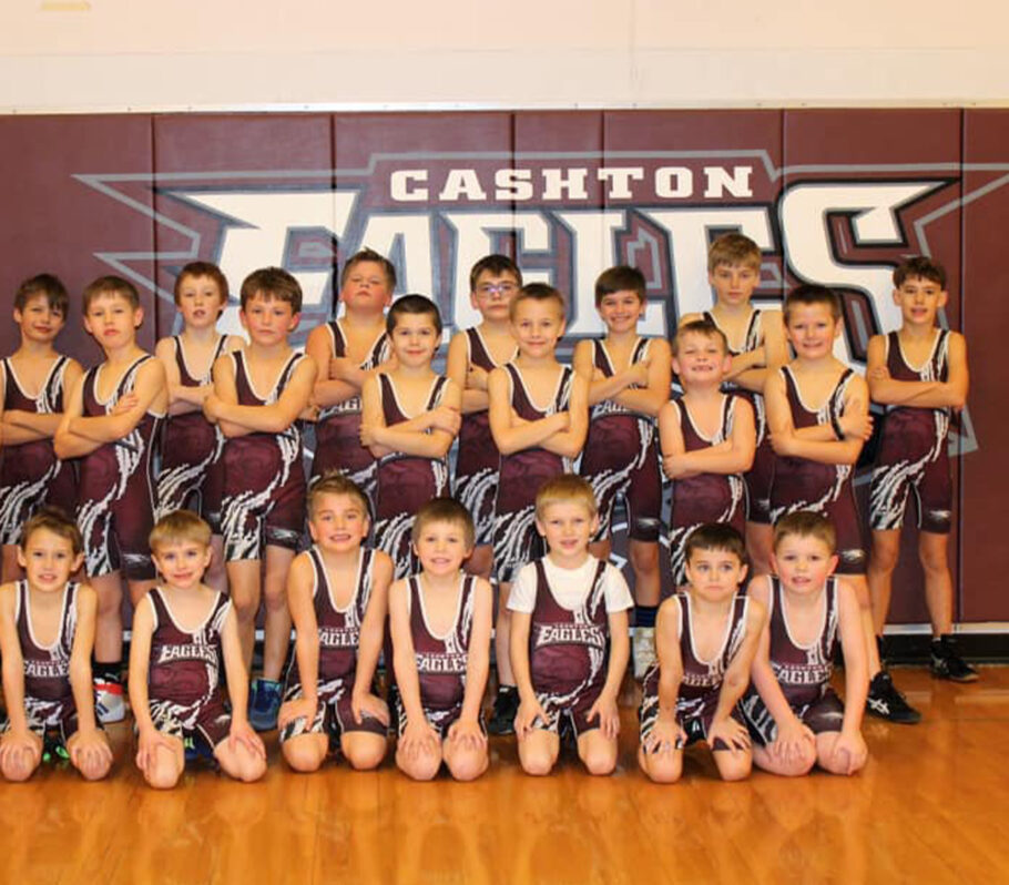 Youth boys wrestling. Image shows team posing for group photo.