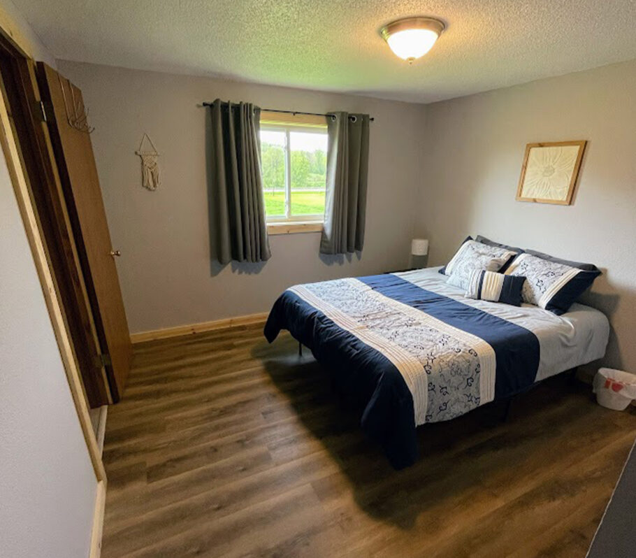 Airbnb lodging in La Crosse County. Image of interior of house highlighting bedroom.
