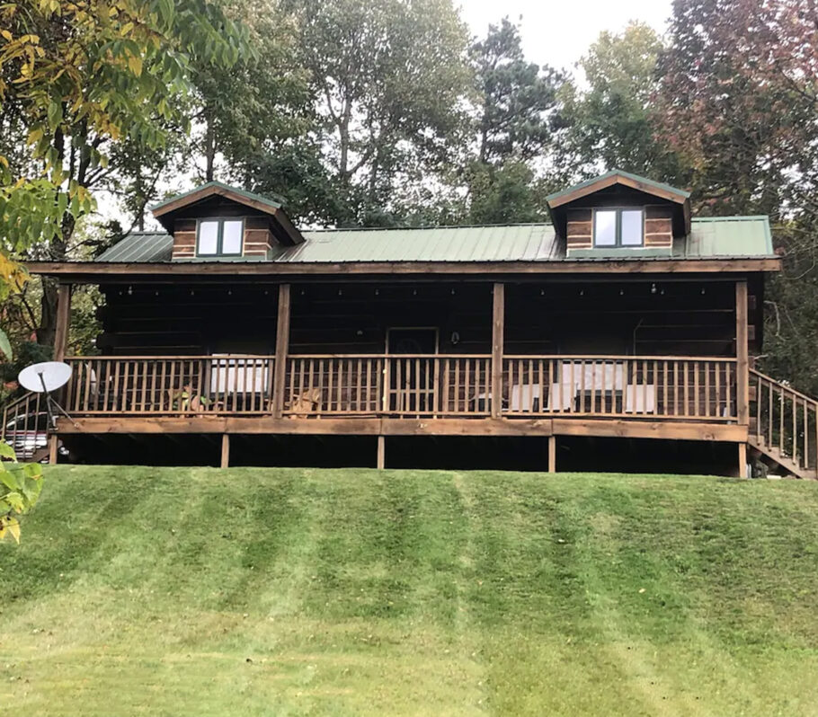 Airbnb lodging in Vernon County. Picture showing cabin property with large deck and yard.