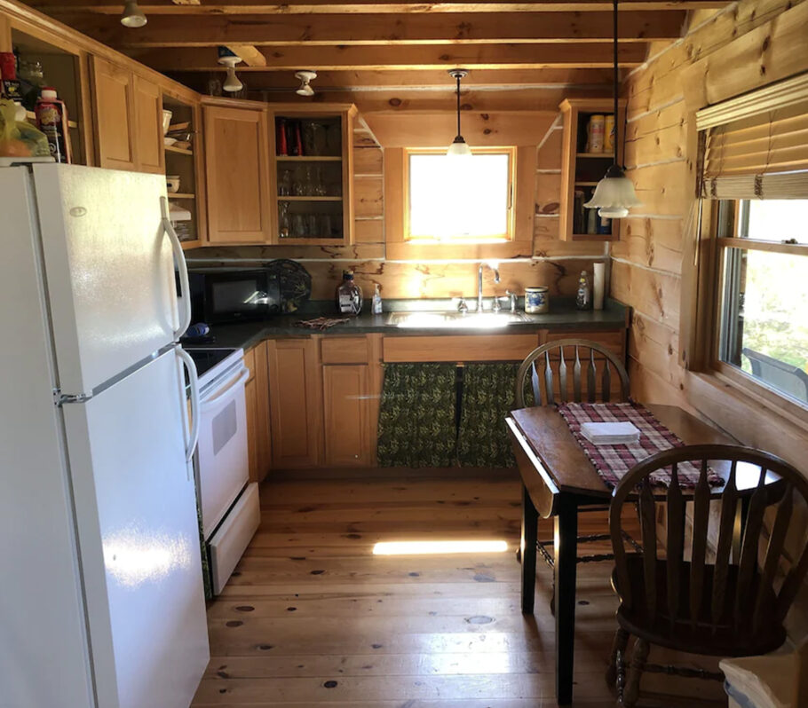 Airbnb lodging in Vernon County. Picture showing interior of wood cabin kitchen.