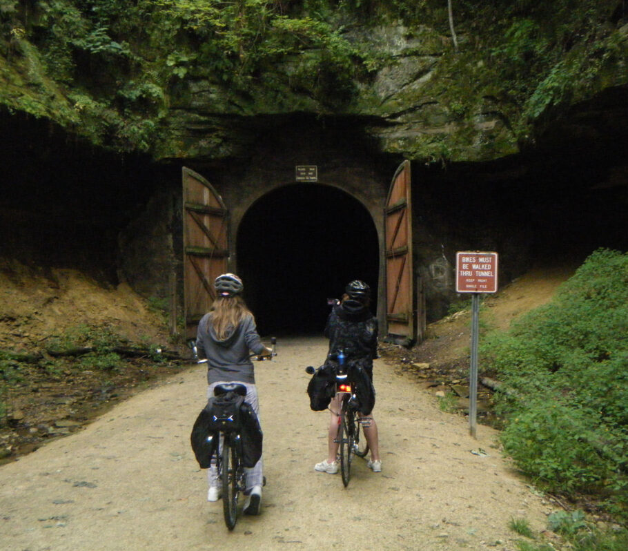 Things to Do in Cashton. Silent Sports. Image of 2 people stopped on bikes before tunnel entrance.